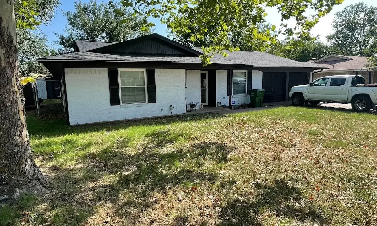 Professional roofing crew working on a residential roof in Cupertino